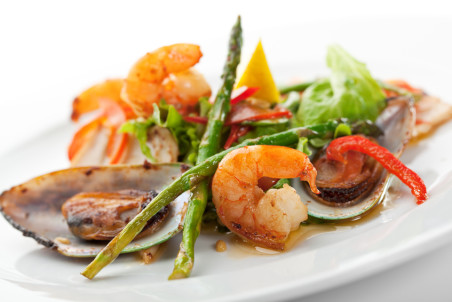 Fried Seafood Salad with Lemon Slice and Asparagus